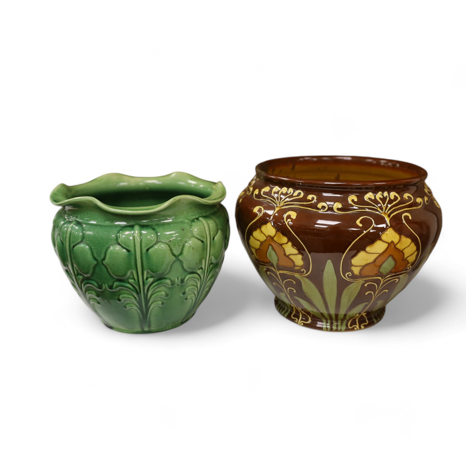 A Wardle decorative Arts and Crafts pottery jardiniere together with a green glazed jardiniere (2). Condition - fair